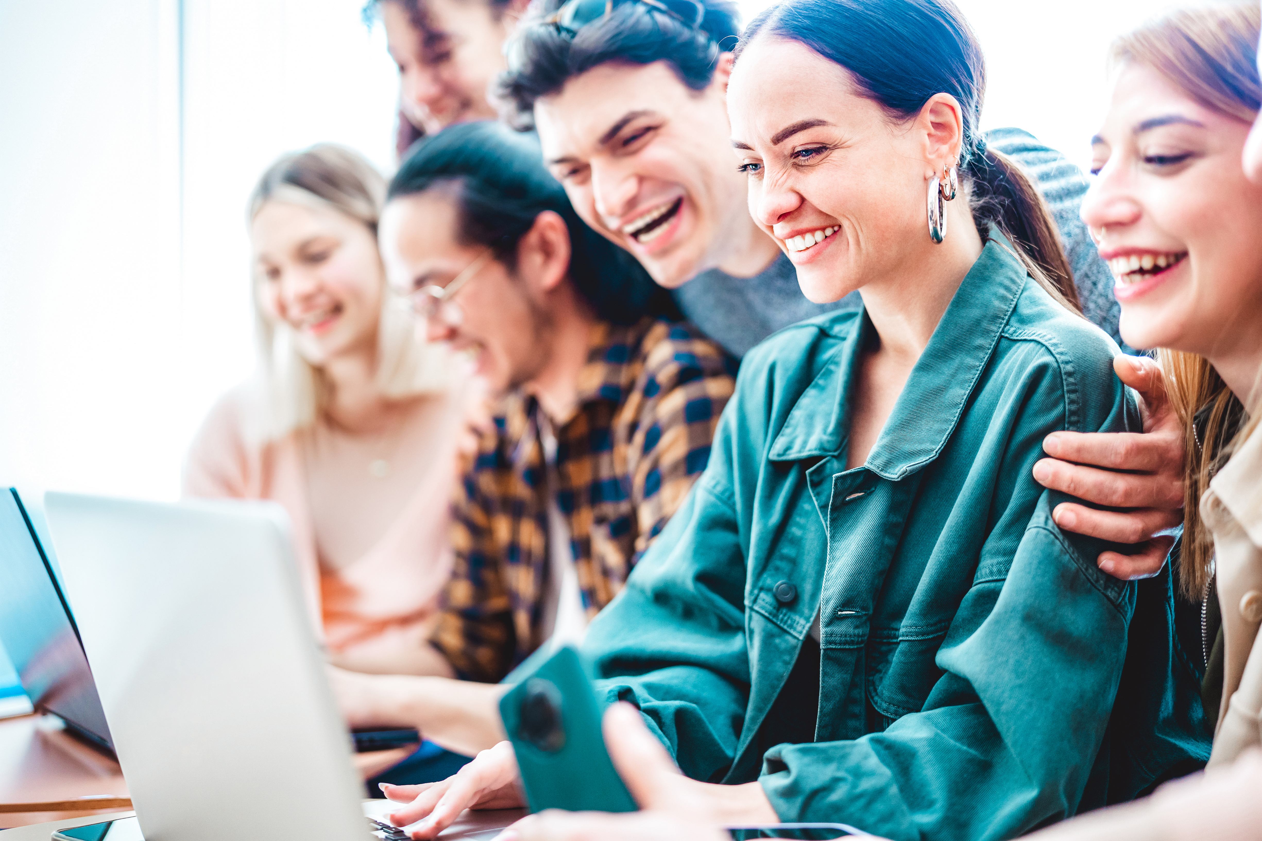 Young millenial students sharing content on laptop at startup studio - Trendy friends life style and teamwork concept on office working time - Start up entrepreneurs at coworking space - Bright filter